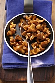 Fried chanterelles in frying pan