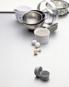 An assortment of baking tins, bowls, cake rings & sieve