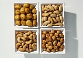 Salted nuts in small bowls