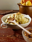 Apricot dumplings with buttered breadcrumbs