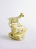 Blue cheese with toy goat