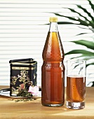 Iced tea in glass and bottle