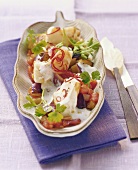 Fish fillet with aubergines, tomatoes and yoghurt sauce