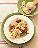 Spaghetti with tomatoes, pine nuts and Parmesan