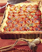 Tomato tart with poppy seeds and chives