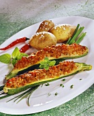 Stuffed courgettes with potatoes cooked in their skins
