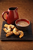 Churros (deep-fried pastries) with chocolate sauce