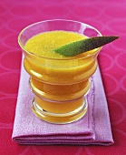 Mango juice with lime wedge