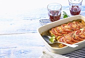Fish bake with tomatoes, red wine (Greece)