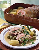 Shoulder of lamb stuffed with olives and almonds