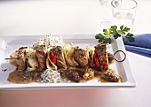 Veal kebab with morel cream sauce and rice