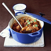 Spicy pork ragout in casserole