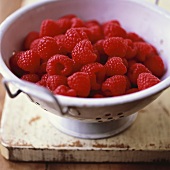 Fresh raspberries in a colander