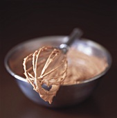Making chocolate cream (mixing chocolate with cream)