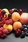 Fruit still life with stone-fruit and berries