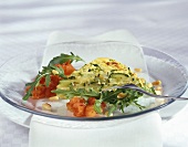 Vegetable frittata, garnished with rocket and tomatoes