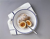 Apricot dumplings with icing sugar