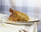 Roast chicken stuffed under the skin, with rice