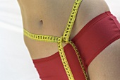 Tape measure tied around someone's waist