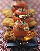 Tomatoes stuffed with mushrooms on breaded bacon escalopes