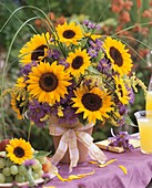 Vase of sunflowers, asters, golden rod and grasses