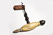 Old corkscrew with wine cork