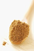 Spice mixture on wooden spoon