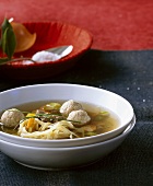 Beef bouillon with dumplings and noodles