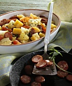 Swede and cabbage stew with sliced Mettwurst
