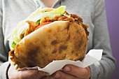Woman holding a döner kebab