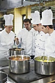Chefs checking cooked vegetables