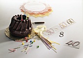 Chocolate gugelhupf and birthday cake decorations