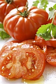 Beefsteak tomatoes, partly sliced and seasoned