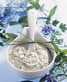 Herb sauce in small bowl with spoon