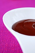 Ketchup in white bowl