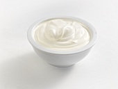 Sour cream in white bowl