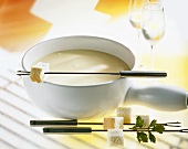 Cheese fondue with cubes of white bread