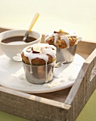 Two apple and cinnamon muffins with coffee