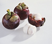 Mangosteens, whole and peeled