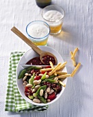Bean salad with grissini, beer