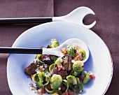Brussels sprout salad with fried goose liver