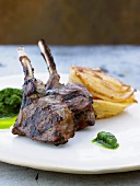 Grilled lamb chops with pesto and potato gratin