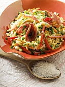 Rice salad with vegetables, sausage and shrimps