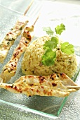 Marinated grilled chicken skewers with rice
