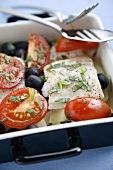 Sea bass fillet with tomatoes, olives and basil
