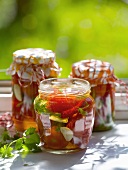 Pickled tomatoes in jars out of doors