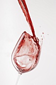 Pouring red wine into glass