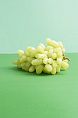 Green grapes on green background