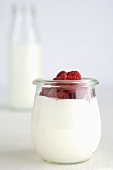 Yoghurt with raspberries in a jar