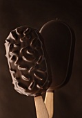 Chocolate-coated ice creams, plain & with almonds, on sticks